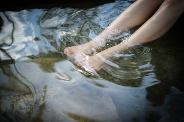 Bare feet soaked in water