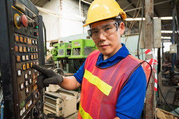 Fototapeta na wymiar Asian Industrial workers are working on projects in large industrial plants with many devices.