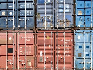 Metal, industrial, multi-colored containers for transportation on ships. Stack of cargo containers...