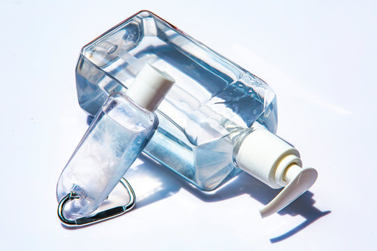 People's hands using portable wash hand sanitizer gel pump dispenser with alcohol gel sanitizer on white, Close up shot, Prevention from covid19, Bacteria, Healthcare, 7 step wash hand