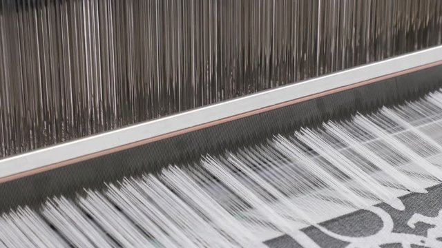 Weaving loom industrial textile production at work