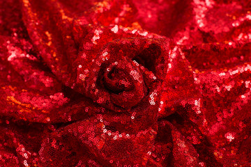 red shiny sequined pleated sequin fabric as background and texture