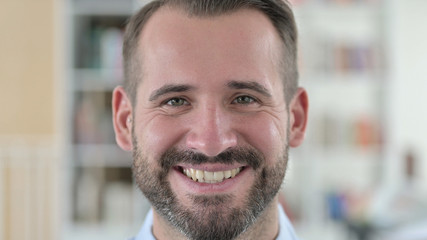 Obraz premium Close Up of Young Man Smiling at Camera