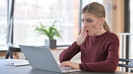 Young Woman in Shock by Results on Laptop in Office