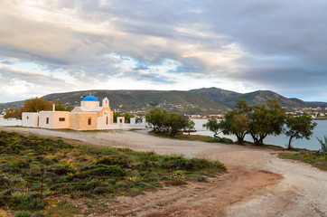 The path to the Greek church on the sea shore of the island of Paros. Greece