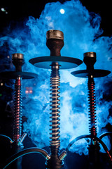 three hookah in the smoke