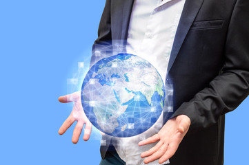 Businessman holds digital globe with hologram of world wide web in palms. Image elements courtesy of NASA.