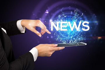 Close-up of a touchscreen with NEWS abbreviation, modern technology concept