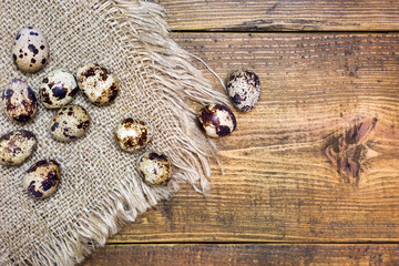 Quail eggs on rustic background