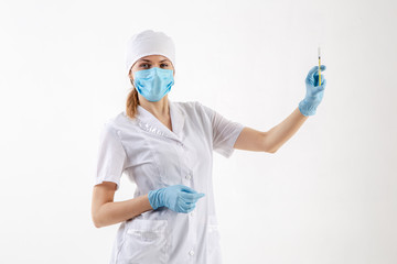 Fototapeta premium Doctor in a white coat holding a syringe.