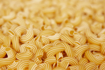 Italian pasta laid out on a white background. Background from pasta, isolate. Concept - food stocks during the covid-19 epidemic
