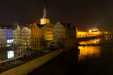 Fototapeta na wymiar Night colorful Prague Old Town with National Theatre from Charles Bridge, Czech republic