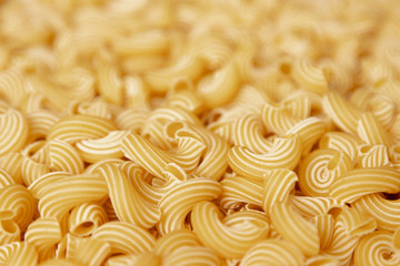 Italian pasta laid out on a white background. Background from pasta, isolate. Concept - food stocks during the covid-19 epidemic