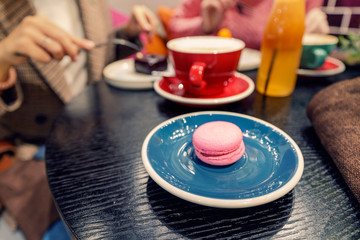 High calorie breakfast with coffee and sweets on the table in cafe