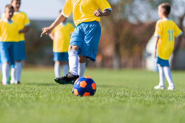 Boys play soccer sports field