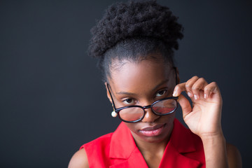 beautiful young african woman on black background