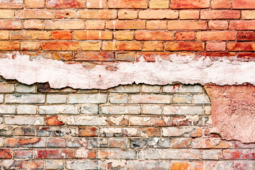 Texture of a brick wall with cracks and scratches which can be used as a background