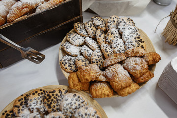 Close up view: cookies with chocolate served on a plate. Several types of cookies