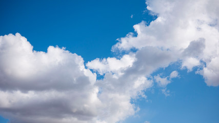 white clouds on a huge blue sky background