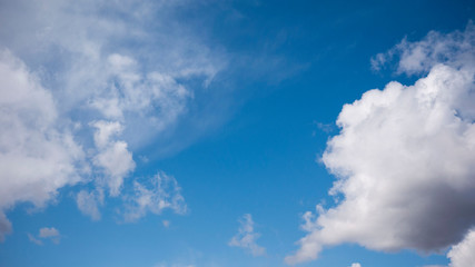 white clouds on a huge blue sky background