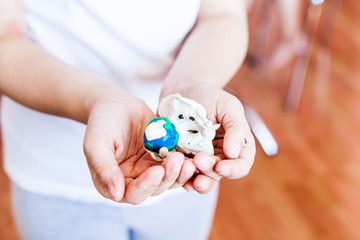 Girl sculpt from plasticine, clay, dough, DIY at home, creativity during holidays, recreation, isolation, quarantine, DIY about quarantine and coronavirus