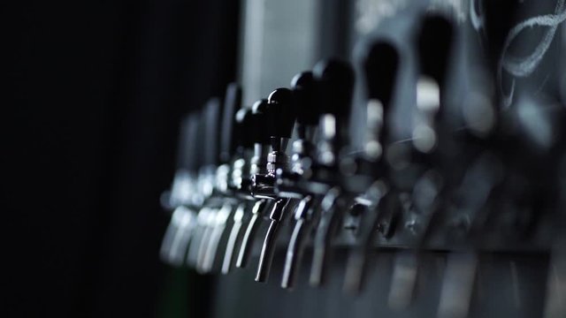 playing focus on stainless steel beer taps