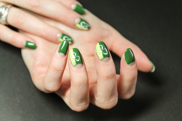 Moon manicure gel Polish with abstract bright and fashionable design on the hands of a modern girl