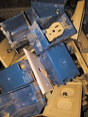 closeup of electrical outlets and boxes