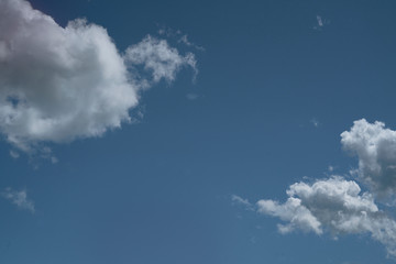 White cumulus clouds formation in blue sky