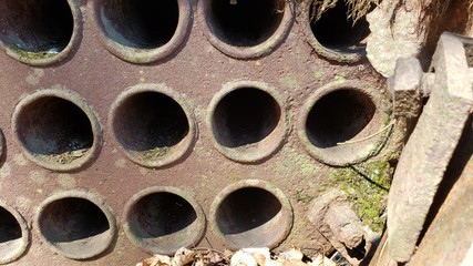 close up of an old rusty metal pipe used for mining