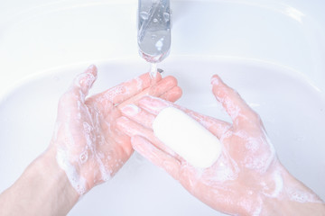 Washing hands in the sink rubbing with soap man for corona virus ,COVID-19 prevention, hygiene to stop spreading coronavirus.Destruction of the virus