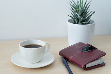 office desk with laptop and caffee