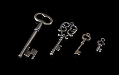 Old keys on a black background