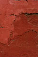 Plaster on the wall, painted in terracotta color. Design background or copy space