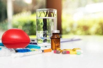 Covid-19 medicine, syringe, injection a white wooden table. Medical and Health care or illness concept. Coronavirus disease 2019, 2019-nCoV.