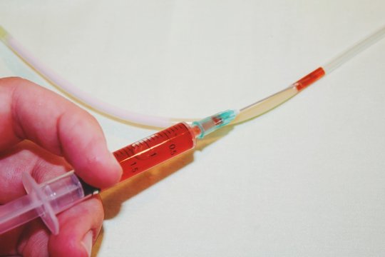 blood test tubes and syringe