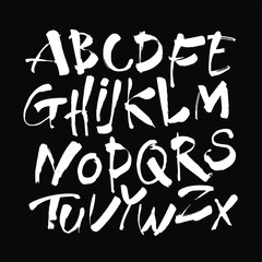 Vector Acrylic Brush Style Hand Drawn Alphabet Font. Calligraphy alphabet on a black background. Ink hand lettering.