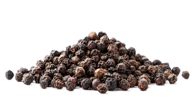 Pile of black pepper peas close-up on a white background. Isolated