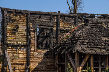 Home after the fire. Survived fragments of the building walls.