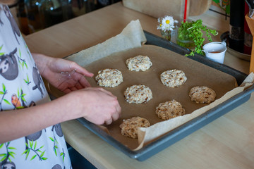 Tray of easy to prepare and healthy, home made outmeal cookies – made by a little child
