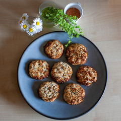 Blue plate of easy to prepare and healthy, home made outmeal cookies – made by a little girl
