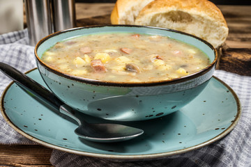 Traditional polish soup Zurek in ceramic bowl.