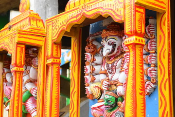 beautifully carved sculpture on a wood.