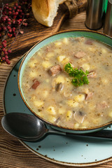Traditional polish soup Zurek in ceramic bowl.