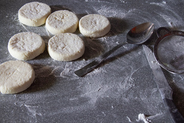 The process of cooking delicious fried cheesecakes closeup on the table. Traditional in Ukraine, Belarus and Russia. The concept of healthy homecooked food