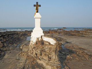 Santa Khuris Mannar Chapel at Morjim beach. Catholic cross located on the beach by the sea