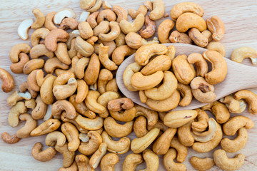 Tasty cashew nuts. The cashew tree is a tropical evergreen tree that produces the cashew seed and the cashew apple.