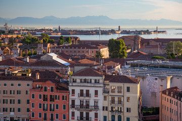 Venice, Italy - Houses on the Venice Canal and Alps in the morning light