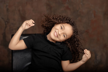 Cute African American girl smiling in the street.
