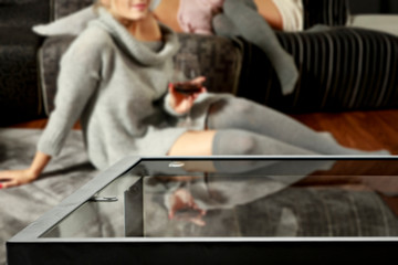 Table background of free space and home interior with girls. 